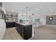 Entertain guests at this stylish bar area with granite counters that connects to a living room at 33105 Kateland Dr, Wesley Chapel, FL 33545