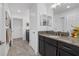 Stylish bathroom showcasing granite countertops, vanity with dual mirrors, and tile flooring at 33105 Kateland Dr, Wesley Chapel, FL 33545