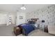 Charming bedroom with unique wallpaper, natural light, and ample space at 33105 Kateland Dr, Wesley Chapel, FL 33545