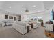 Expansive living room with abundant natural light, recessed lighting, and a large sectional sofa at 33105 Kateland Dr, Wesley Chapel, FL 33545