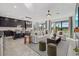 Open concept living space featuring a kitchen, dining, and living room with modern decor and ample natural light at 33105 Kateland Dr, Wesley Chapel, FL 33545