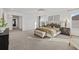 Bright and airy main bedroom featuring soft carpet, and large windows at 33105 Kateland Dr, Wesley Chapel, FL 33545