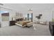 Spacious main bedroom featuring a chandelier, large windows and natural light at 33105 Kateland Dr, Wesley Chapel, FL 33545