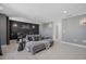 Cozy media room with comfortable seating, a movie theme, and custom wall decor at 33105 Kateland Dr, Wesley Chapel, FL 33545