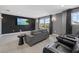 Enjoy movies in this theater room with comfortable seating and large screen at 33105 Kateland Dr, Wesley Chapel, FL 33545