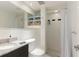 Bright bathroom features white subway tiles, black accents, granite countertop, and an open storage shelf at 3325 Bayshore Blvd # D11, Tampa, FL 33629