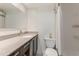Modern bathroom features granite countertop, dark wood cabinets, and tiled shower with white subway tile at 3325 Bayshore Blvd # D11, Tampa, FL 33629