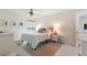 This bright bedroom boasts neutral decor, a ceiling fan, and natural light from the window at 3325 Bayshore Blvd # D11, Tampa, FL 33629