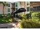 Inviting condo building entrance with a covered walkway and lush landscaping at 3325 Bayshore Blvd # D11, Tampa, FL 33629
