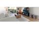 Bright living room features a comfortable white sofa, wood coffee table, and sliding glass doors to the outside at 3325 Bayshore Blvd # D11, Tampa, FL 33629