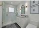 Modern bathroom features a glass enclosed shower, updated vanity, and stylish accents at 3418 Overlook Ne Dr, St Petersburg, FL 33703