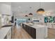 Open kitchen flows into the living area, creating a welcoming and stylish space with water view at 3418 Overlook Ne Dr, St Petersburg, FL 33703
