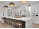 Bright kitchen featuring a marble countertop island with seating and stainless steel appliances at 3418 Overlook Ne Dr, St Petersburg, FL 33703