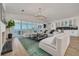 Bright living room with waterfront views, comfortable seating, and a modern wet bar for entertaining at 3418 Overlook Ne Dr, St Petersburg, FL 33703
