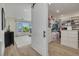 Main bedroom boasts a large walk-in closet, outside views, and wood-look flooring at 3418 Overlook Ne Dr, St Petersburg, FL 33703