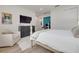 Comfortable bedroom with wood floors, neutral tones, and a view to the hall at 3418 Overlook Ne Dr, St Petersburg, FL 33703
