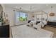 Bright main bedroom features a canopy bed, water view, sitting area, and modern décor at 3418 Overlook Ne Dr, St Petersburg, FL 33703