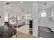 Main bedroom with walk-in shower, neutral walls, and light wood-look flooring throughout at 3418 Overlook Ne Dr, St Petersburg, FL 33703