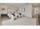Bright main bedroom features a canopy bed, ceiling fan, sitting area, and modern décor at 3418 Overlook Ne Dr, St Petersburg, FL 33703