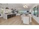 Bright open floor plan featuring spacious kitchen, dining area, and living room with water view at 3418 Overlook Ne Dr, St Petersburg, FL 33703