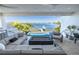 Inviting outdoor space with comfortable seating, a fire pit, and a stunning waterfront view with a pool and boat dock at 3418 Overlook Ne Dr, St Petersburg, FL 33703
