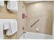 Bright bathroom featuring a clean white tub, tiled walls, and convenient shower amenities at 36750 Us 19 N # 06211, Palm Harbor, FL 34684