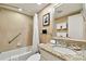 Bright bathroom with tile flooring, granite countertops, and shower/tub combo at 36750 Us 19 N # 06211, Palm Harbor, FL 34684
