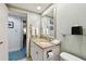 Well-lit bathroom features granite countertop, vanity, and linen service for convenience at 36750 Us 19 N # 06211, Palm Harbor, FL 34684