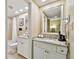 Bathroom featuring granite countertops, white cabinets, and modern fixtures at 36750 Us 19 N # 06211, Palm Harbor, FL 34684