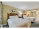 Bedroom with two queen beds, neutral walls and blue carpet at 36750 Us 19 N # 06211, Palm Harbor, FL 34684