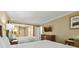 Bright bedroom featuring two queen beds, a work desk, and a flat screen TV at 36750 Us 19 N # 06211, Palm Harbor, FL 34684