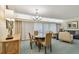 Bright and airy dining area features a stylish chandelier and comfortable seating at 36750 Us 19 N # 06211, Palm Harbor, FL 34684