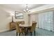 Well-lit dining area with a round table and scenic views at 36750 Us 19 N # 06211, Palm Harbor, FL 34684