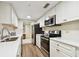 Well-equipped kitchen with stainless steel appliances, sleek countertops, and ample storage at 36750 Us 19 N # 06211, Palm Harbor, FL 34684