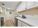 Well-lit kitchen with white cabinetry, stainless steel appliances, and quartz countertops at 36750 Us 19 N # 06211, Palm Harbor, FL 34684