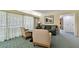 Bright living room featuring a comfortable couch, two armchairs, and a large window with sheer curtains at 36750 Us 19 N # 06211, Palm Harbor, FL 34684
