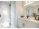 Modern bathroom featuring a walk-in shower, sleek vanity, and contemporary fixtures at 401 N Oregon Ave # 1, Tampa, FL 33606