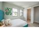 Bright bedroom with a modern bed frame, large windows, and an adjacent closet space at 401 N Oregon Ave # 1, Tampa, FL 33606