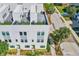 Modern multi-story townhouse featuring a rooftop terrace with outdoor seating, landscaping and sleek architectural design at 401 N Oregon Ave # 1, Tampa, FL 33606