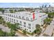 This multi-story townhouse boasts a modern exterior with rooftop terraces and community amenities, for urban living at 401 N Oregon Ave # 1, Tampa, FL 33606
