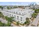 This multi-story townhouse boasts a modern exterior with rooftop terraces and community amenities, for urban living at 401 N Oregon Ave # 1, Tampa, FL 33606