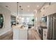 Modern kitchen featuring stainless steel appliances, white cabinets, and an open-concept design at 401 N Oregon Ave # 1, Tampa, FL 33606