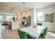 Bright kitchen and dining area featuring modern appliances, stylish seating, and contemporary finishes at 401 N Oregon Ave # 1, Tampa, FL 33606