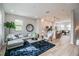 Bright, open-concept living space with modern furnishings and decor, seamlessly flowing into the kitchen at 401 N Oregon Ave # 1, Tampa, FL 33606