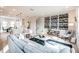 Stylish living room with modern decor, a large sofa, and an open layout flowing into the kitchen at 401 N Oregon Ave # 1, Tampa, FL 33606