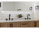 Modern bathroom featuring a double vanity, lighted mirror, and stylish fixtures at 4105 W Iowa Ave, Tampa, FL 33616