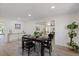 Bright dining room features wood floors, an area rug, and modern decor at 4105 W Iowa Ave, Tampa, FL 33616