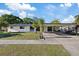 Charming single-story home with a covered carport and well-maintained front yard at 4105 W Iowa Ave, Tampa, FL 33616