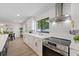 Bright kitchen with white cabinets, quartz countertops, stainless steel oven, and natural light at 4105 W Iowa Ave, Tampa, FL 33616