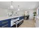 Kitchen island with stainless steel microwave drawer and open concept layout at 4105 W Iowa Ave, Tampa, FL 33616